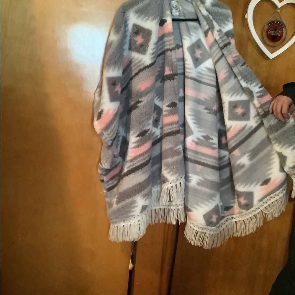 A woman’s Pancho like sweater made of wool